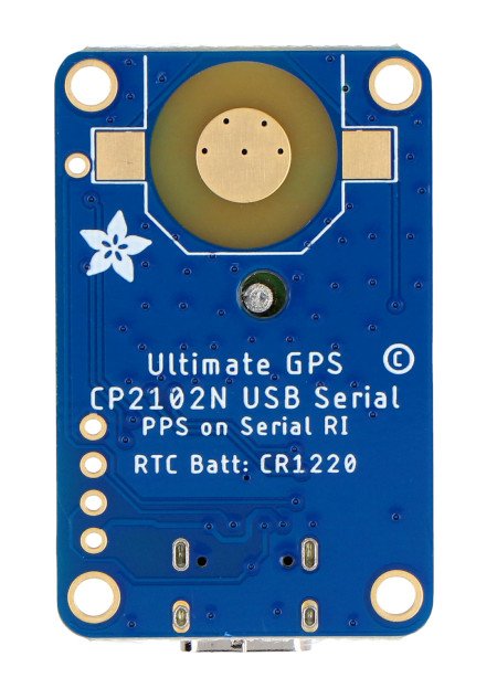 The ultimate gps gnss module lies upside down on a white background.