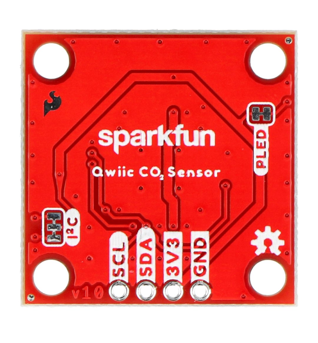 The red sparkfun temperature, humidity and CO2 sensor lies upside down on a white background.