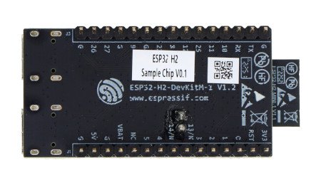 The black ESP32-H2 development board lies upside down on a white background.