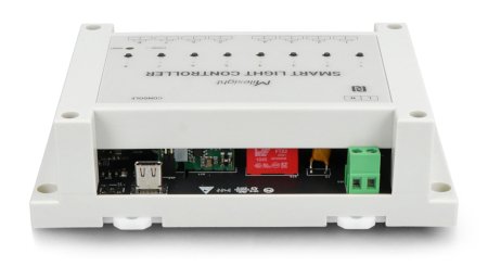 The creamy white lorawan lighting controller lies on a white background from an underside perspective.