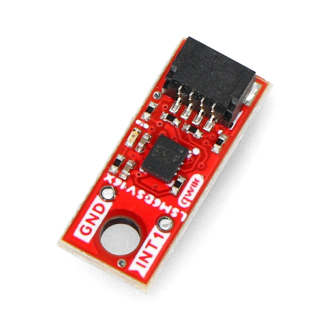 The red IMU sensor micromodule lies on a white background.