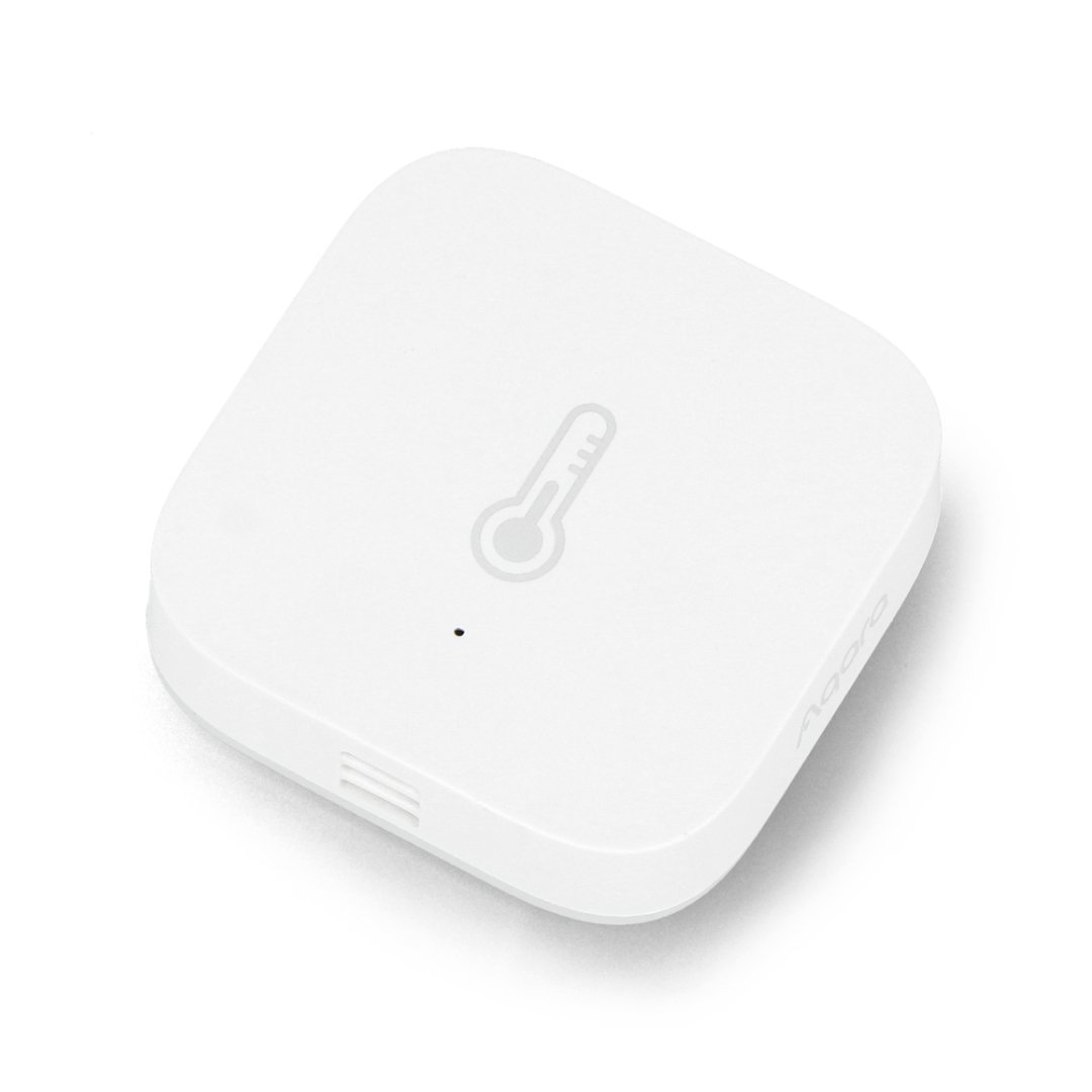 White and smart temperature sensor lies on a white background.