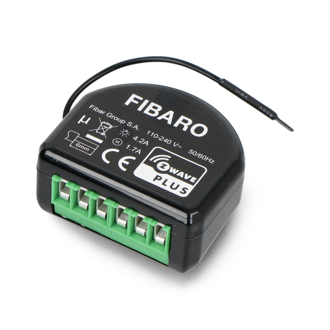 The Fibaro roller shutter controller in a black casing lies on a white background.